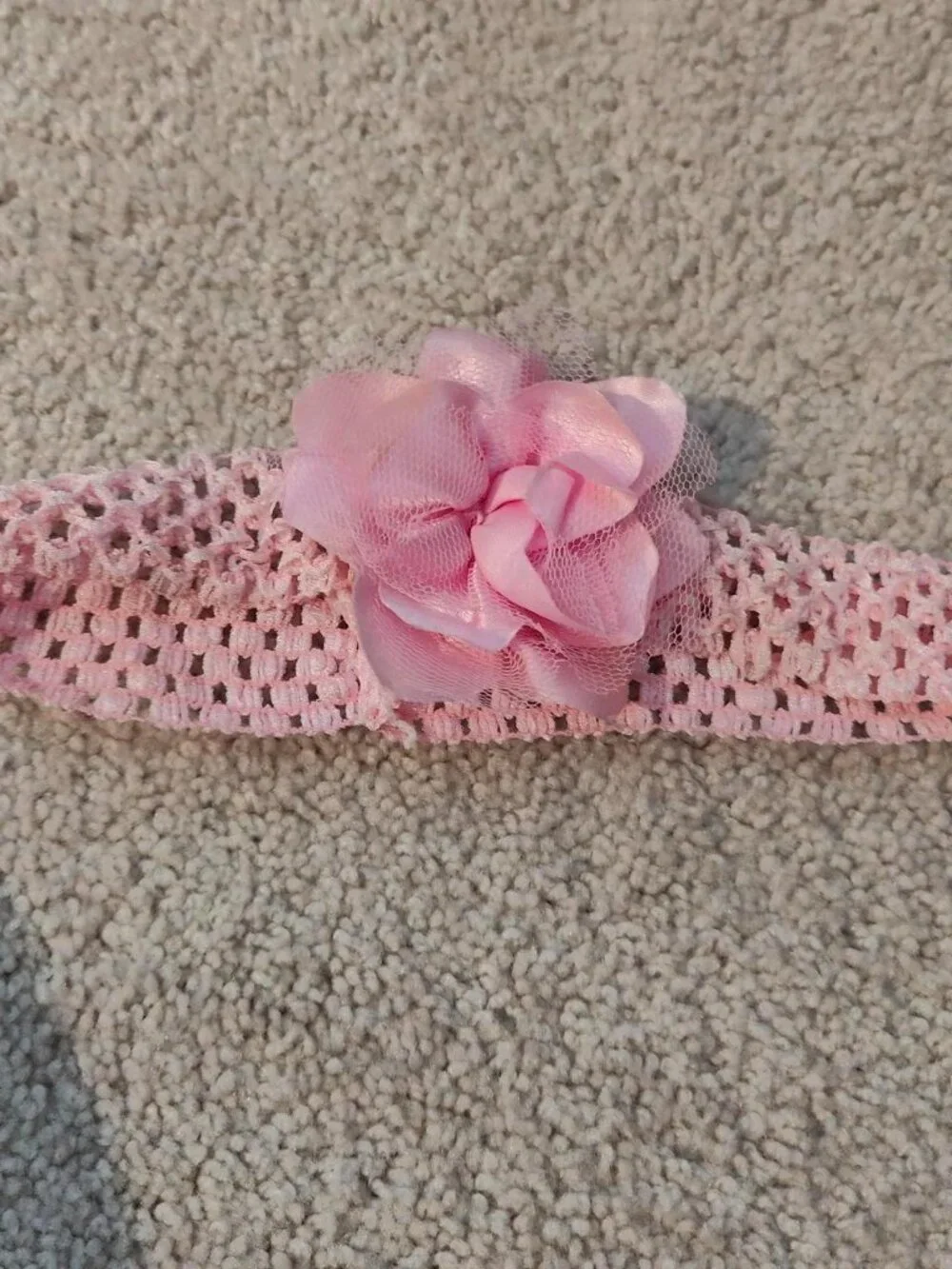 Pink crochet headband with flower detail